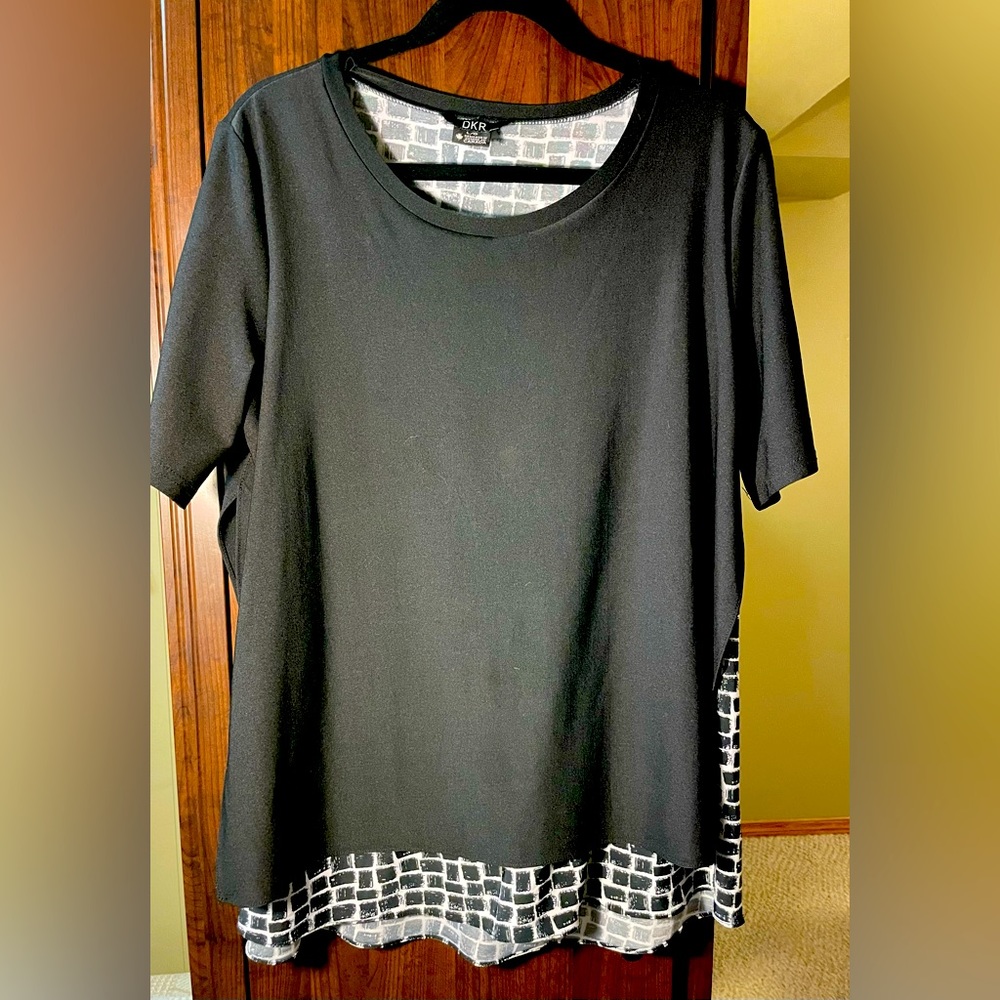 Relaxed tshirt style with a built in layering.  Black with print showing under